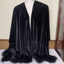 A long feather boa used as a shoulder wrap.