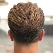 A close view of a neatly tapered fade haircut