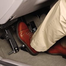 Pair of feet operating pedals