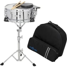A snare drum positioned among the other drums in a drum kit.