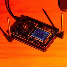A theremin with two upright antennas and its control panel.