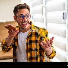 A person reacting with pleased surprise