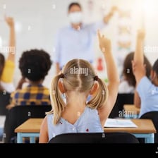 A person raising a hand to volunteer