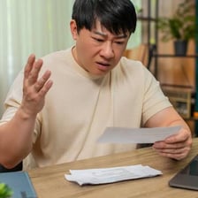 A frustrated person reacting to an outcome they did not want.