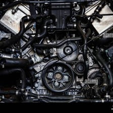 A mechanical motor viewed inside an automobile engine compartment.