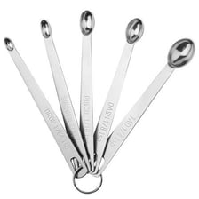 A measuring spoon holding a small amount of an ingredient.