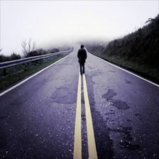 A person sprinting away from a scene