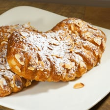 A bear claw pastry with its characteristic split, claw-like shape.