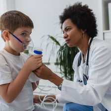 A doctor provides urgent care to a patient in a hospital.