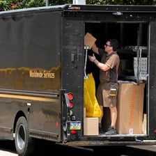 A UPS delivery truck bearing the company’s brown-and-gold branding.