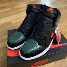 A pair of high-top sneakers displayed as fashion footwear.