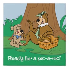 Yogi Bear, the cartoon character, carrying a picnic basket.