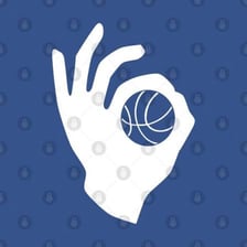 A basketball player taking a long three-point shot from near the center-court logo