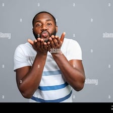 A person blowing a kiss.
