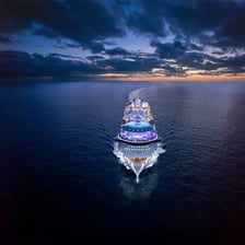 A cruise ship traveling across open water