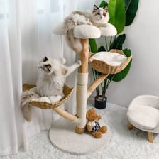 A tall indoor cat tree with platforms and scratching posts