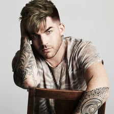 Portrait of singer Adam Lambert performing.