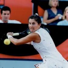 Monica Seles playing competitive tennis.