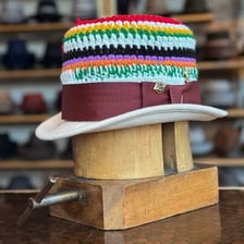 A boater hat and a bowler hat shown together.