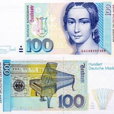 Euro banknotes shown alongside older European currency.