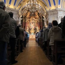 A congregation participating in a Catholic Mass.