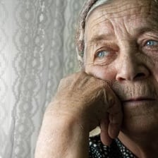 A person with a visibly gloomy, pensive expression.