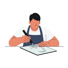 A person putting pen to paper to make a drawing.