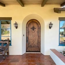 An open front door leads into a welcoming home.