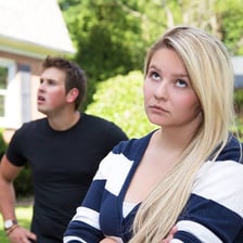 A person displaying a contemptuous sneer.