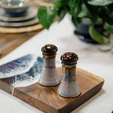 Salt and pepper shakers placed side by side