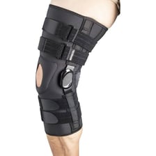 A person wearing a supportive knee brace