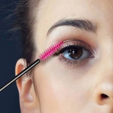 A cosmetic mascara wand with a bristled applicator