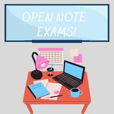 Students taking an exam with reference notes on their desks.