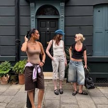 A person wearing backless mule shoes