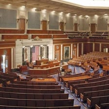 U.S. senators and representatives gathered in a congressional chamber.
