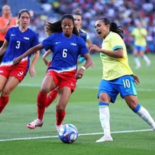 United States women's soccer players competing in a match