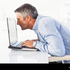 A person visually examining an object closely
