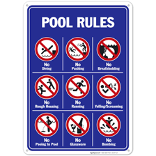 A swimming pool area with safety signs