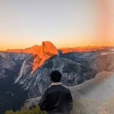 A person gazing in wonder at a breathtaking landscape.