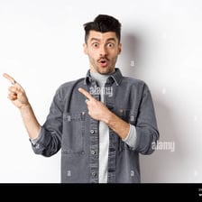 A person pointing toward something to draw attention to it