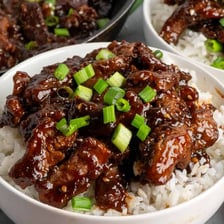 A cooked dish coated with glossy teriyaki sauce