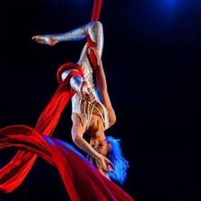 Acrobatic performers executing an aerial stunt