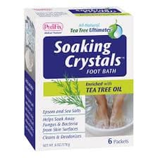 Epsom salt crystals beside a warm footbath