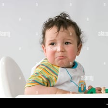 A person making a small pout or sulky expression
