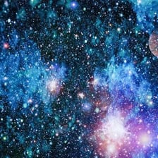 A wide view of galaxies and stars conveying the immense scale of the universe.