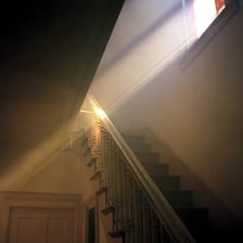 A bright ray of sunlight entering through a window