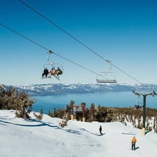 A ski instructor teaching beginners on a gentle slope