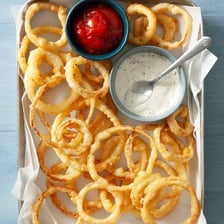Crispy golden onion rings served as an appetizer