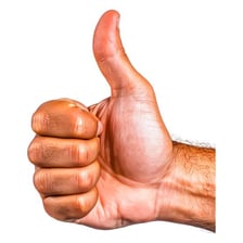 A person giving a thumbs-up to signal approval