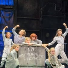 A performance scene from the musical Annie
